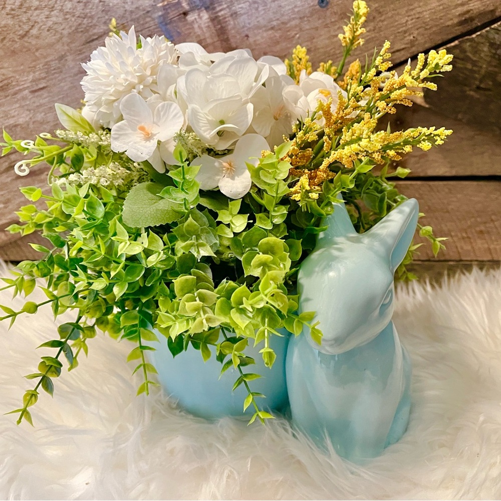 Ceramic blue bunny flower arrangement.